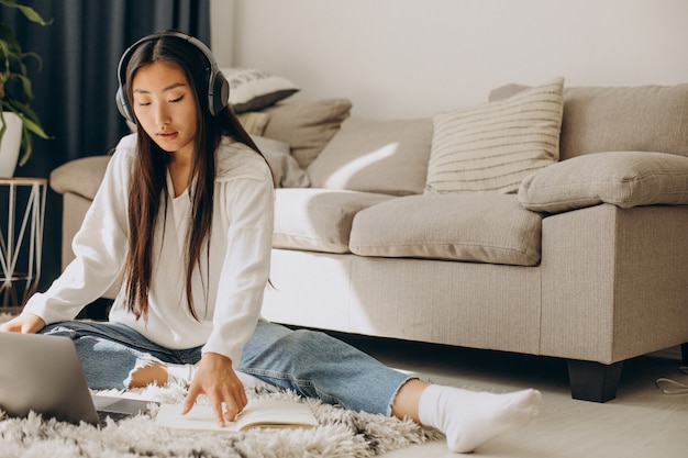 Woman with earphones, listening to seminar