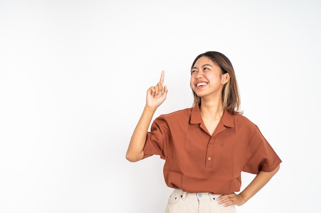 Woman with finger pointing up hand gesture on isolated background