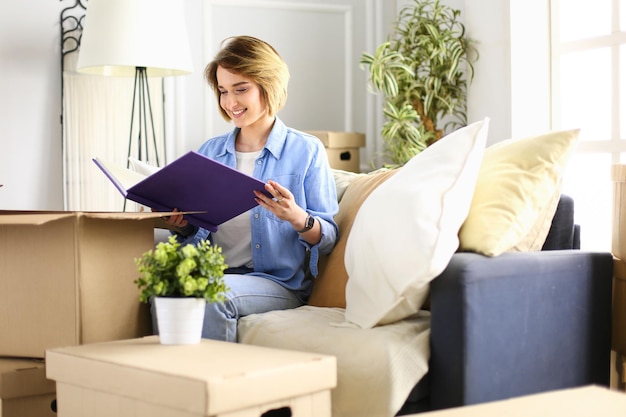 A woman with a folder checks if everything is in place