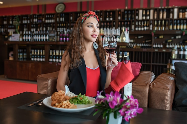 woman with a glass of red wine