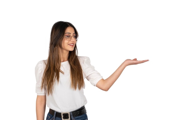 A woman with glasses is holding an open palm up and the word.