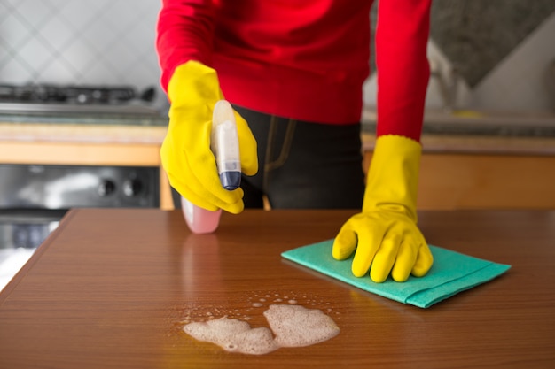Woman with gloves doing the cleaning