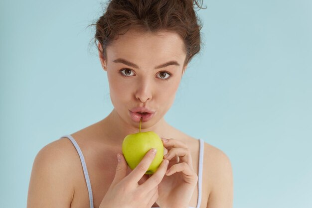 Woman with green apple Woman holding green apple and smiling