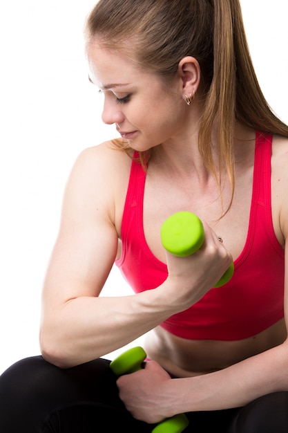 Woman with a green dumbbell