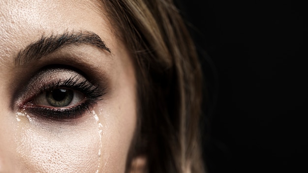 Woman with green eyes crying