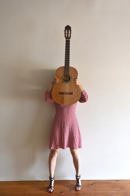 Woman with a guitar on her face