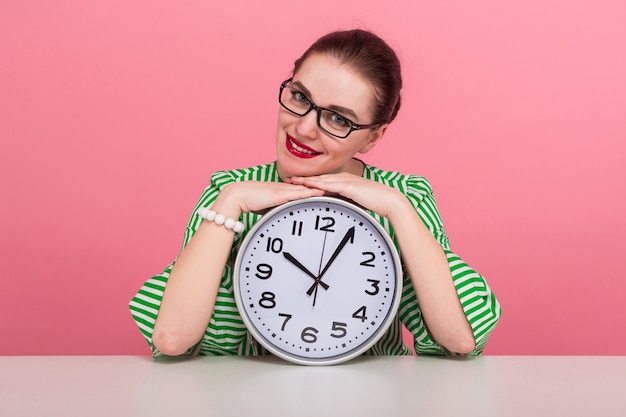 Woman with hair bun and clocks