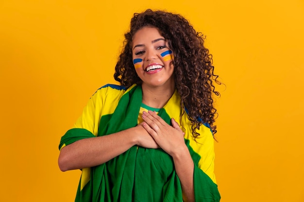 Woman with hand on heart with sign of gratitude and patriot September 7 Independence of Brazil