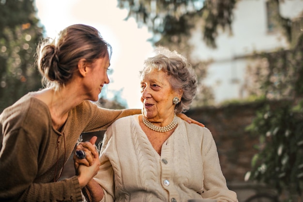 a woman with a hand on her shoulder is talking to a woman