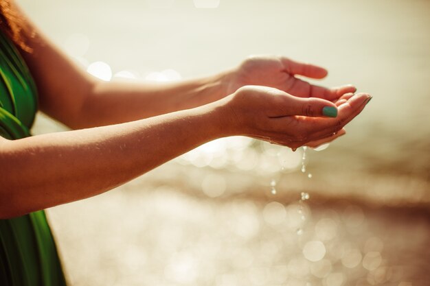 Woman with hands full of water