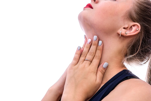 Woman with hands on throat. Pain concept isolated on white