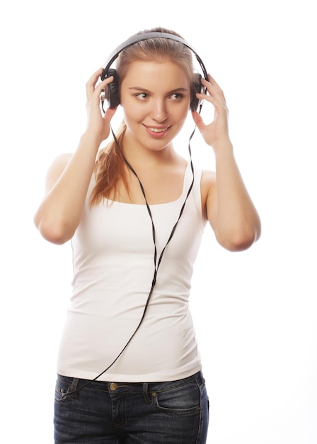 Woman with headphones listening music Music teenager girl isol