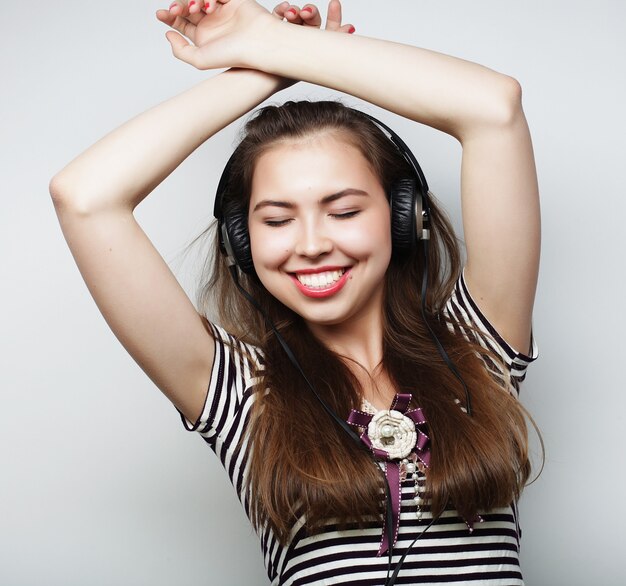 Woman with headphones listening music