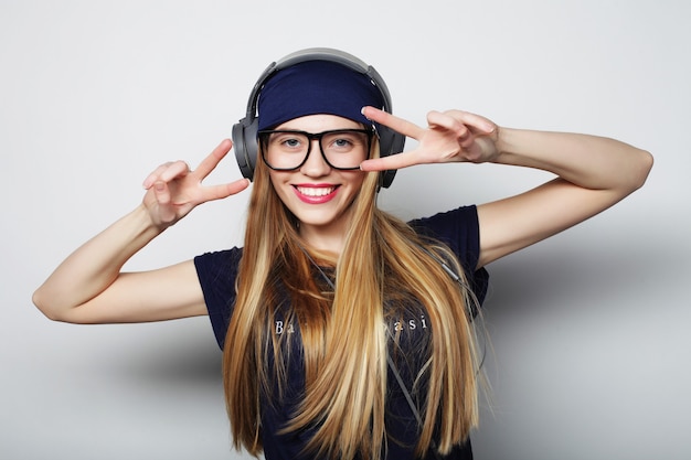 Woman with headphones listening music