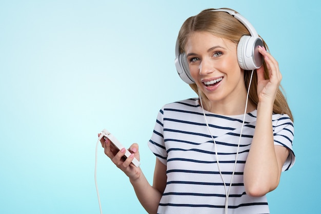 Woman with headphones listening music