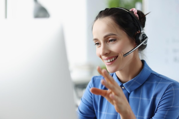 Woman with headphones and microphone communicating online hotline remote assistance concept