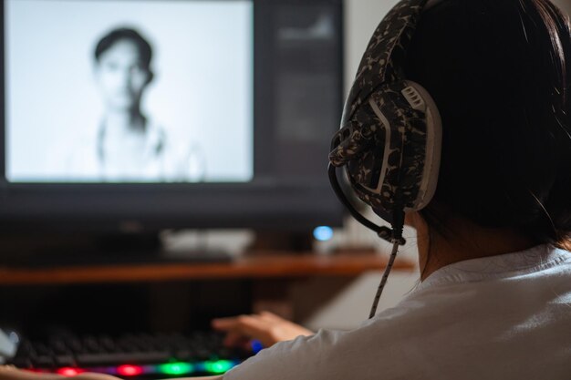 Woman with headphones working on photo editing