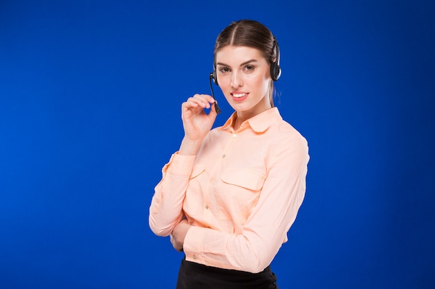 Woman with a headset and a credit card