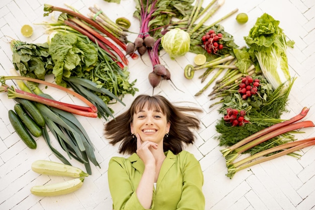 Woman with healthy food ingredients above her head