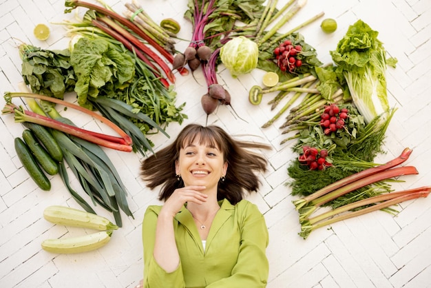 Photo woman with healthy food ingredients above her head