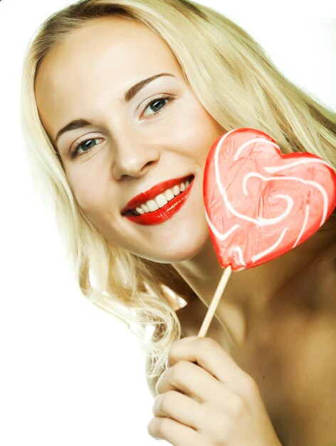 Woman with heart lolly pop