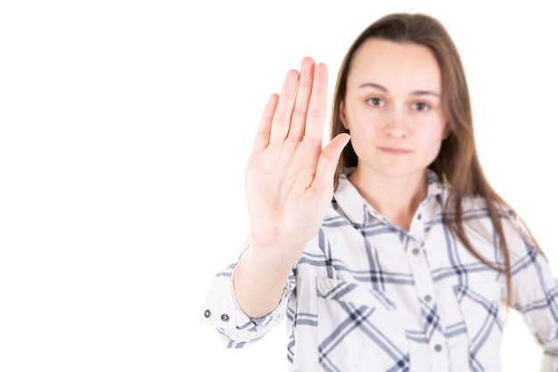 Photo woman with her hand signaling stop of violence international women day