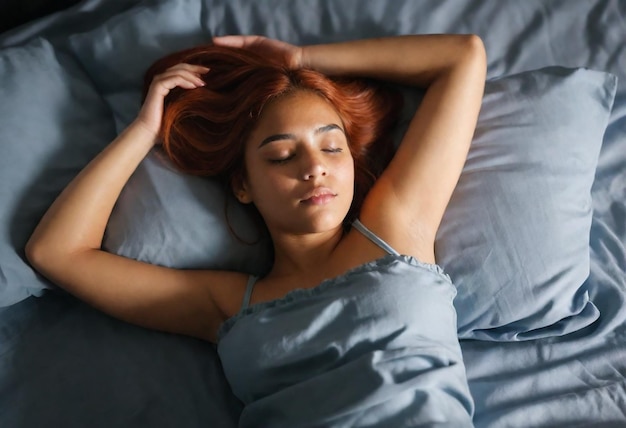 a woman with her head wrapped in a grey blanket