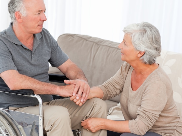 Woman with her husband in a wheelchair