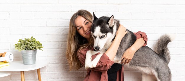 Woman with her husky in studio