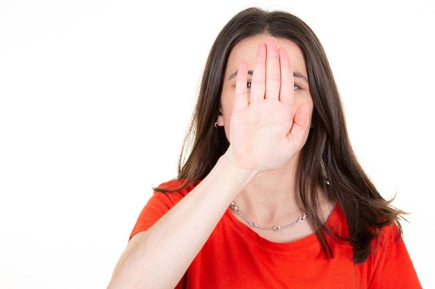 Woman with her palm hand signaling stop of violence concept international women day