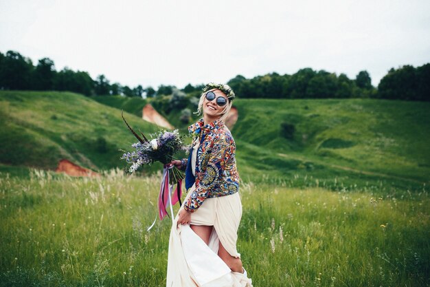 Woman with hippie clothes in the field