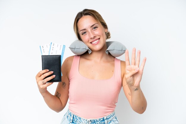 Woman with Inflatable Travel Pillow over isolated background happy and counting four with fingers