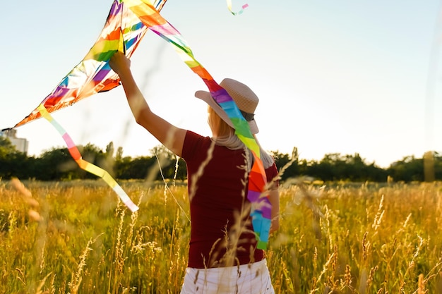 woman with a kite in the field