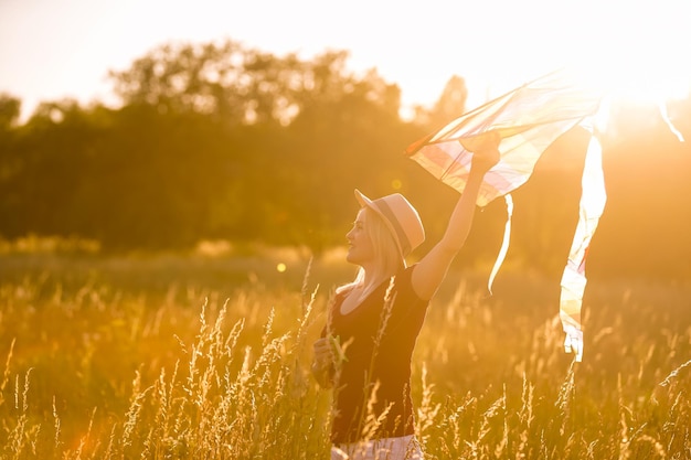 woman with a kite in the field