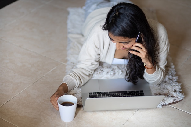 Woman with laptop home office working