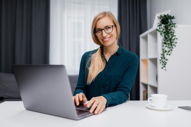 Woman with laptop at home