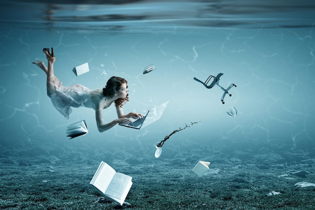 Woman with laptop underwater. Mixed media