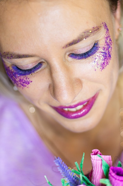 Woman with Large beautiful eyes with color lash