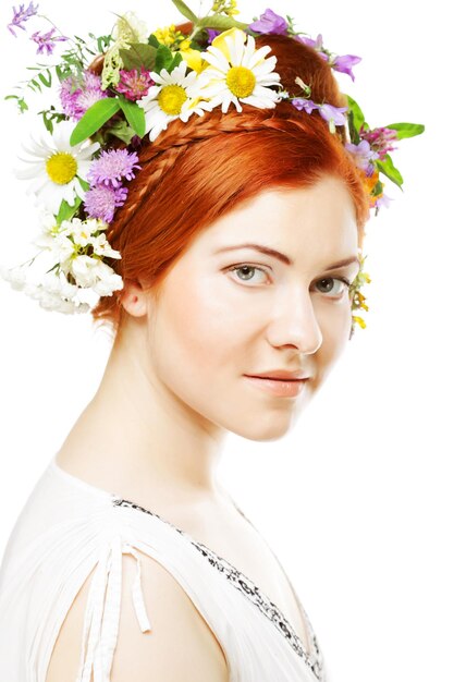 Woman with large hairstyle and flowers in her hair