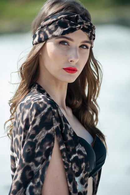 A woman with a leopard print headband