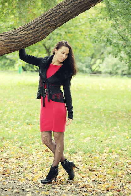 Woman with long hair in summer park