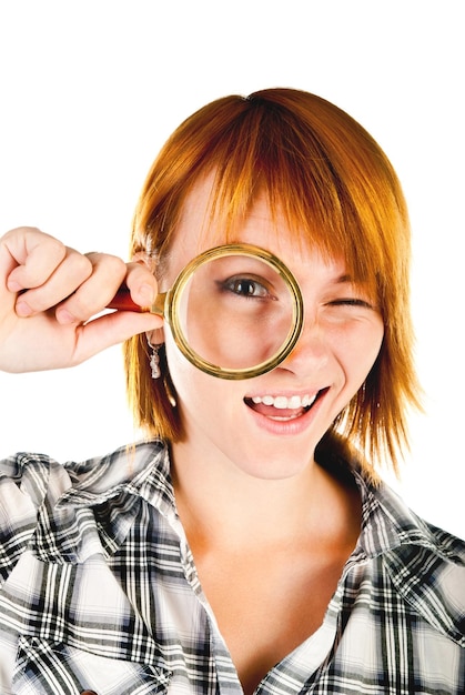 Woman with magnifying glass isolated on a white background