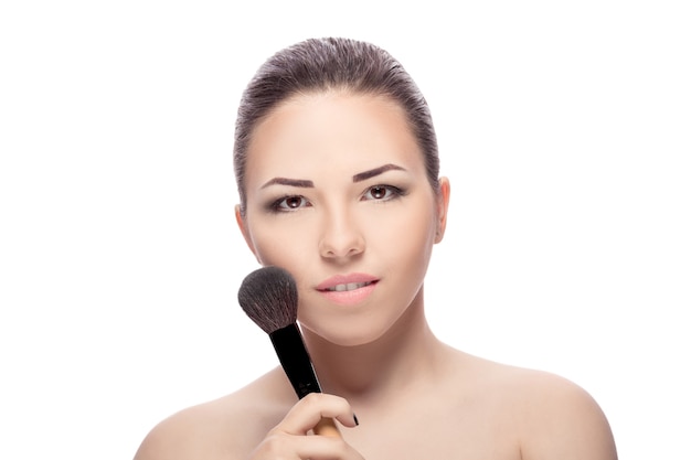 Woman with makeup brushes