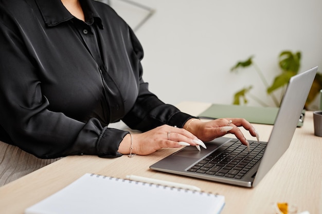 Woman with Manicure Typing at Keyboard