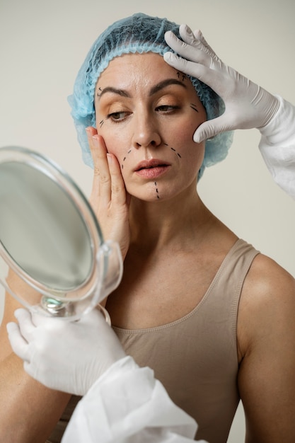 Photo woman with marker traces on face