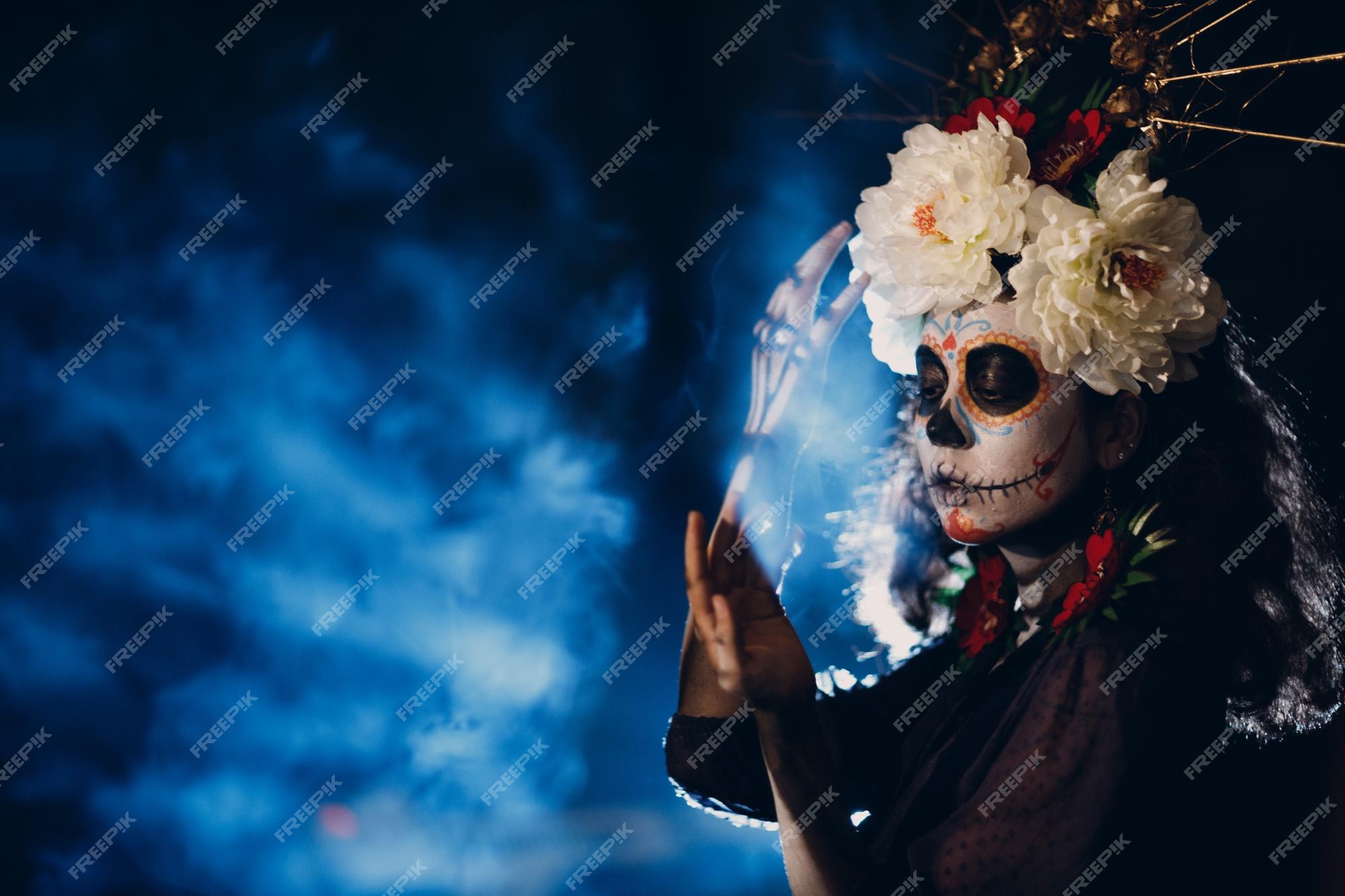 Premium Photo | Woman with mexican skull halloween makeup on her face day of the and halloween