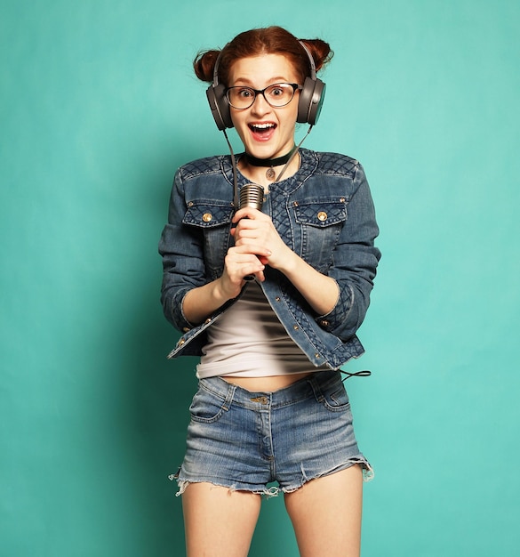 Woman with microphone jump in the air