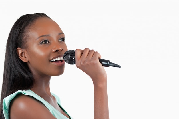 Woman with microphone singing