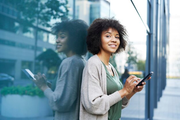 Woman with mobile phone in the city