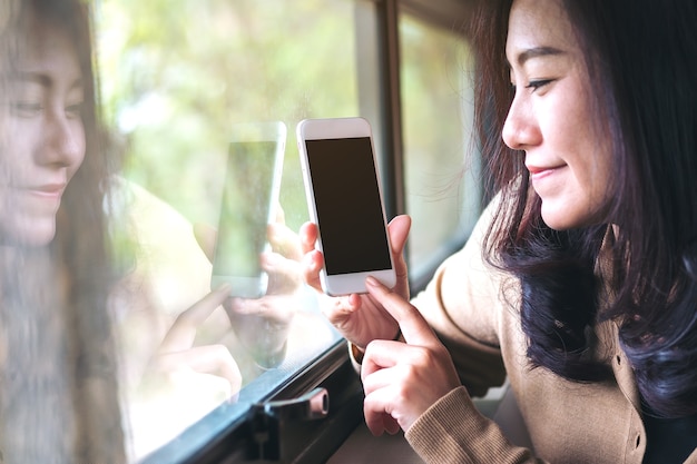 Woman with mockup smartphone